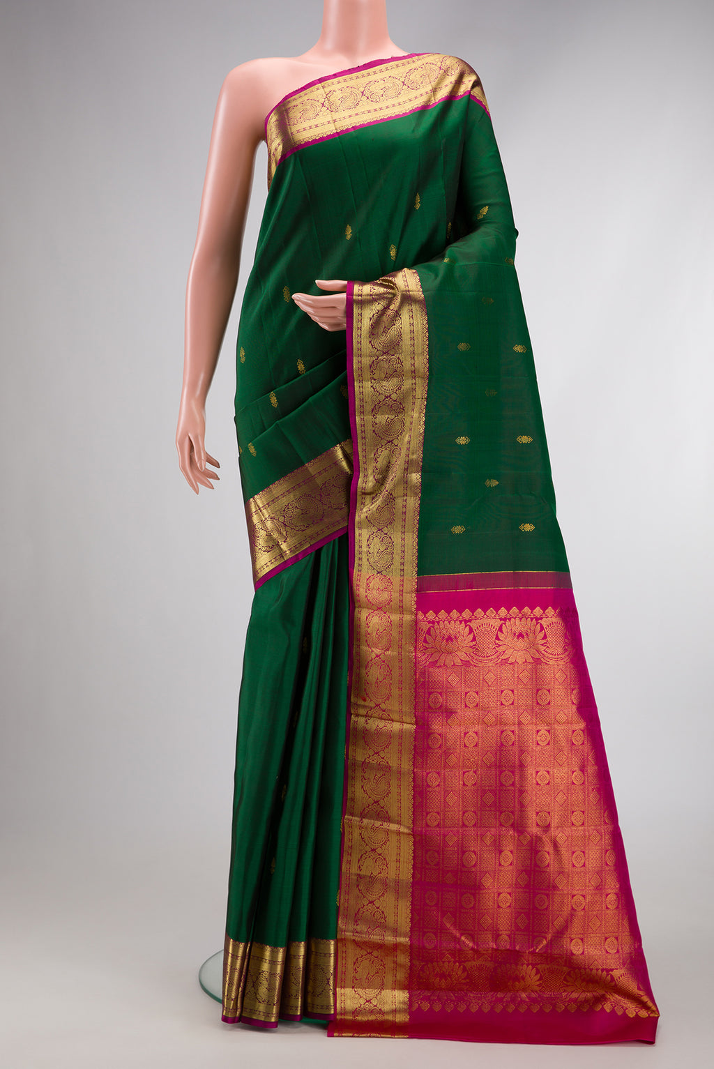 Bottle Green Dual Tone Kanjivaram Silk Saree with Zari Butta on the body and Zari Border.  displayed on a mannequin
