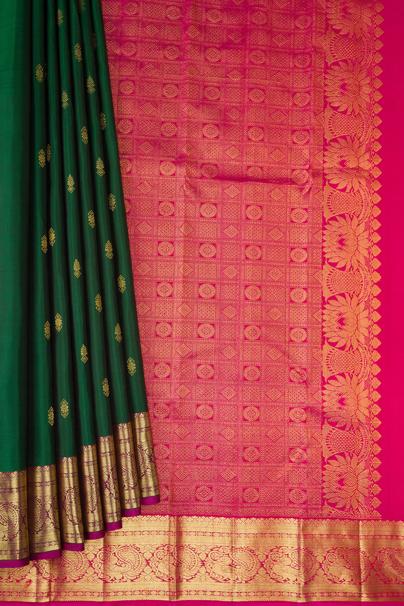 Pleats and pallu of Bottle Green Dual Tone Kanjivaram Silk Saree with Zari Butta on the body and Zari Border. 