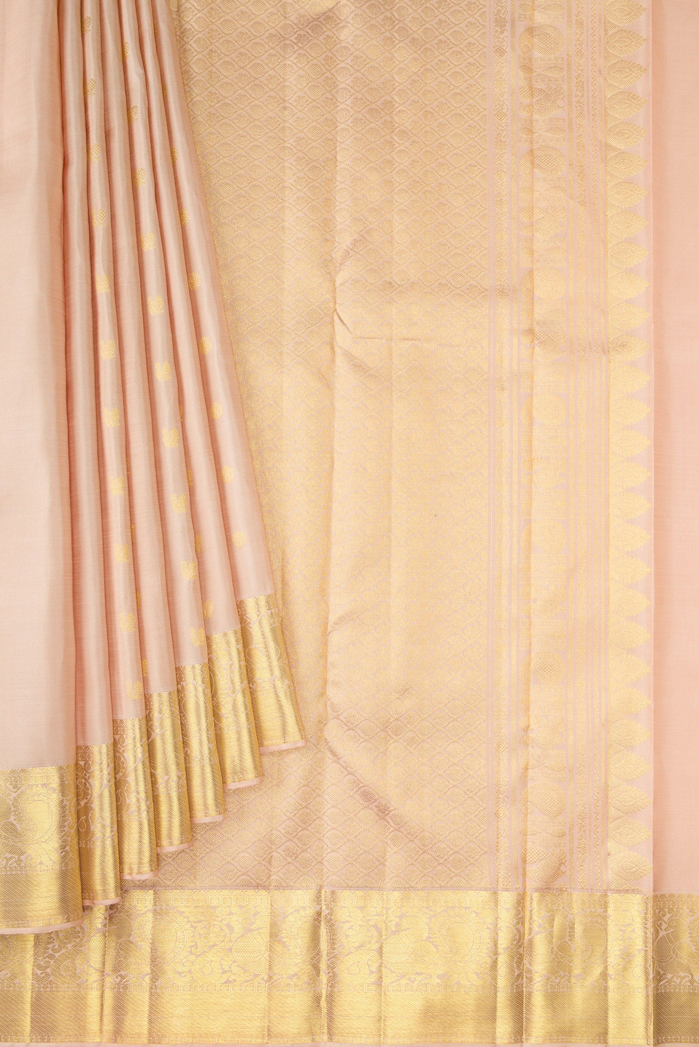 Pleats and pallu of Beige Dual Tone Kanjivaram Silk Saree with Zari Butta on the body and Zari Border. 
