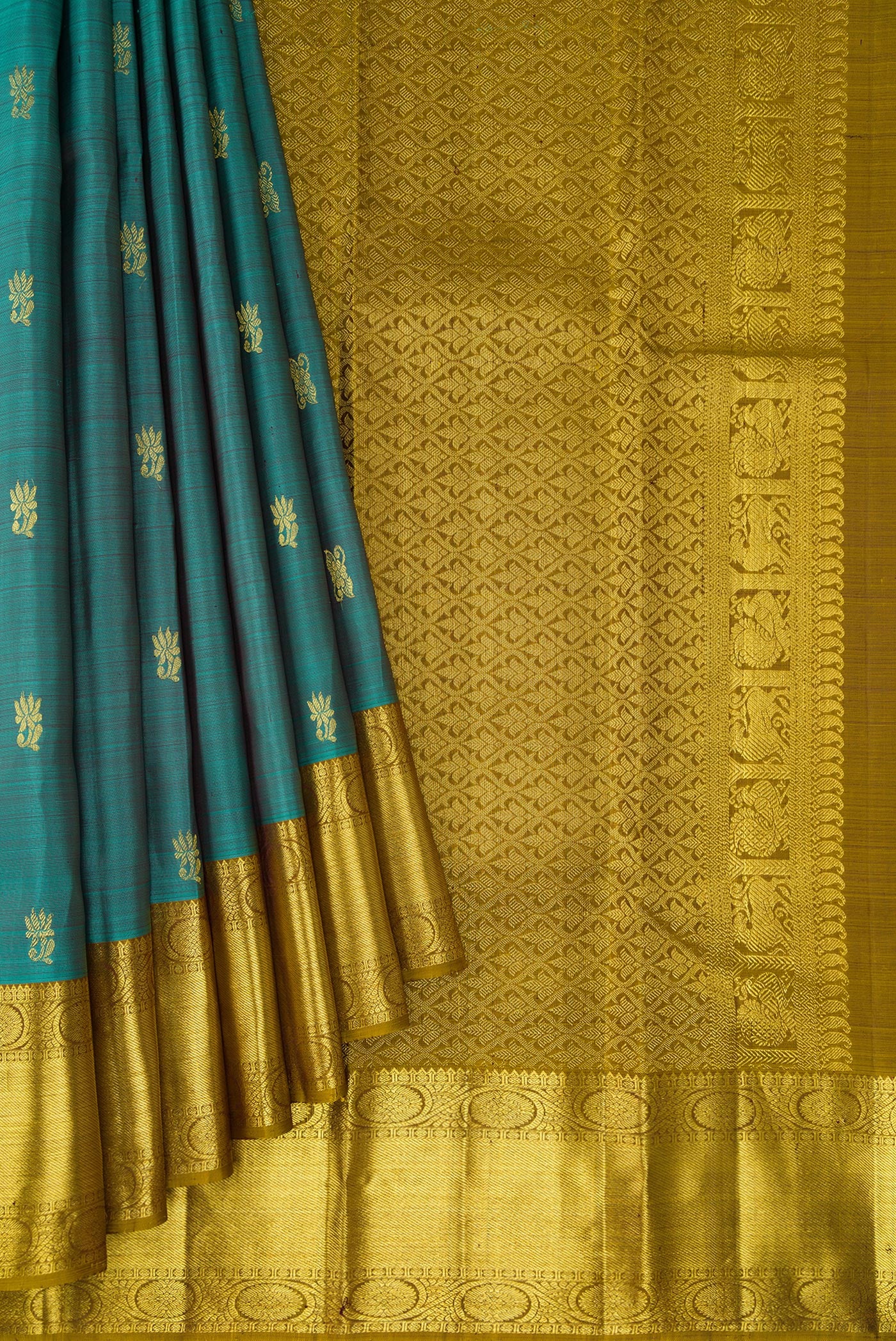 Pleats and pallu of Teal Dual Tone Kanjivaram Silk Saree with Zari Butta on the body and Zari Border. 
