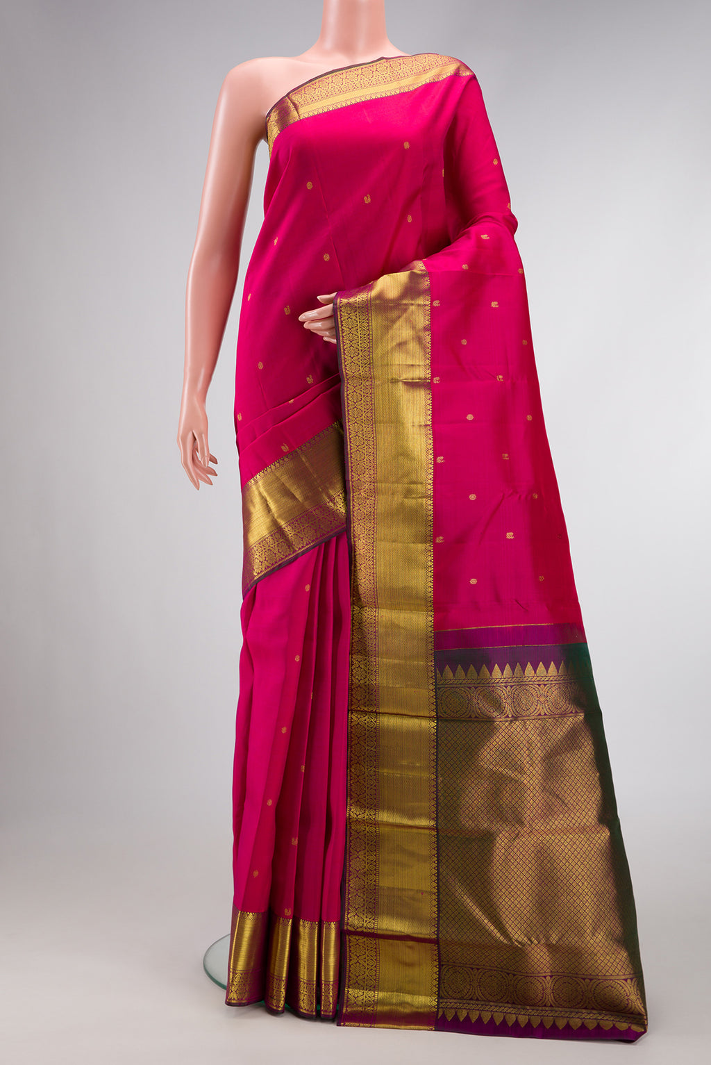 Dark Pink Dual Tone Kanjivaram Silk Saree with Zari Butta on the body and Zari Border.  displayed on a mannequin