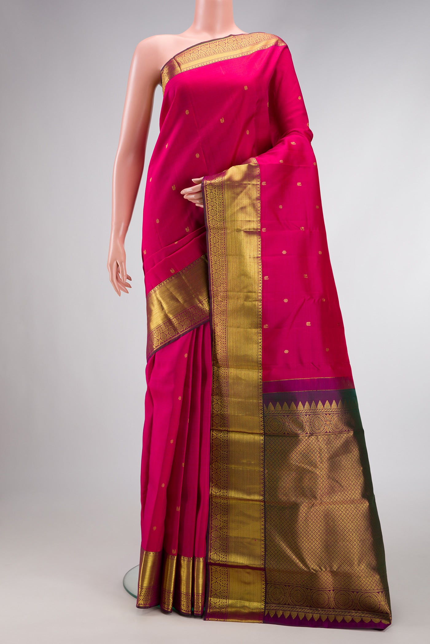 Dark Pink Dual Tone Kanjivaram Silk Saree with Zari Butta on the body and Zari Border.  displayed on a mannequin