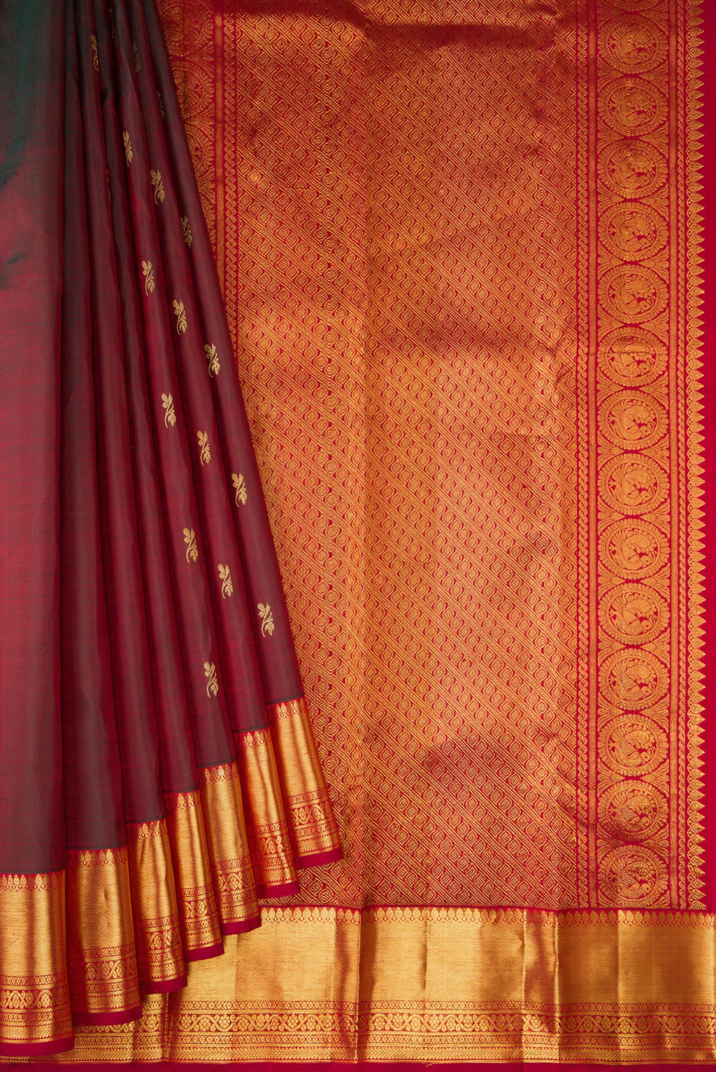 Pleats and pallu of Maroon Dual Tone Kanjivaram Silk Saree with Zari Butta on the body and Zari Border. 