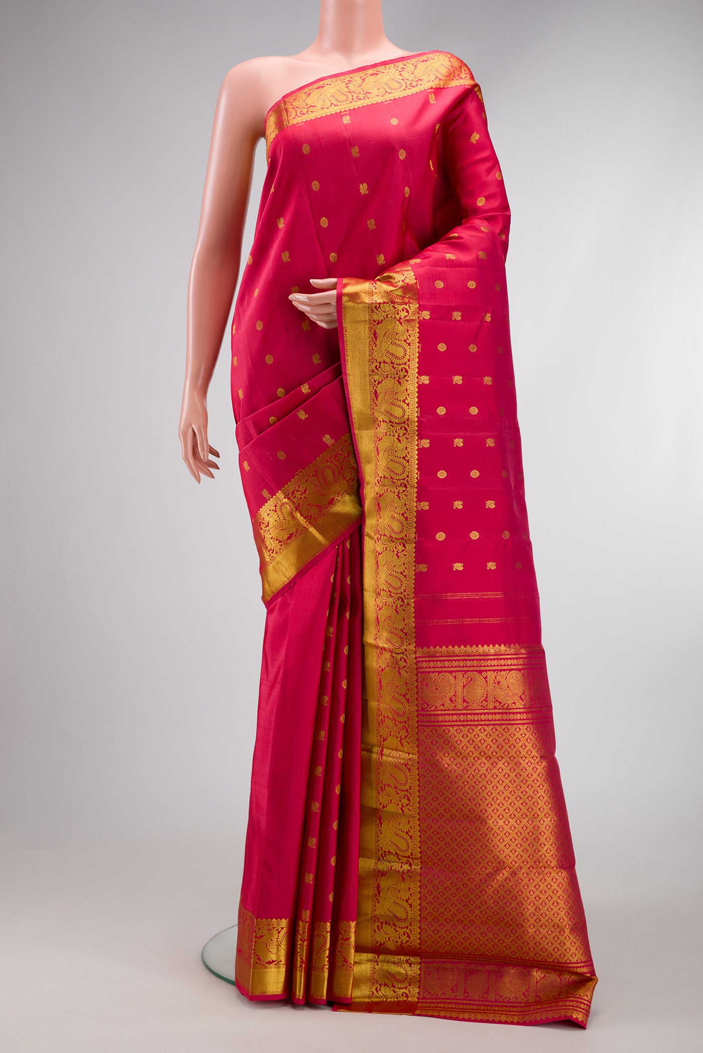Dark Pink Dual Tone Kanjivaram Silk Saree with Zari Butta on the body and Zari Border.  displayed on a mannequin