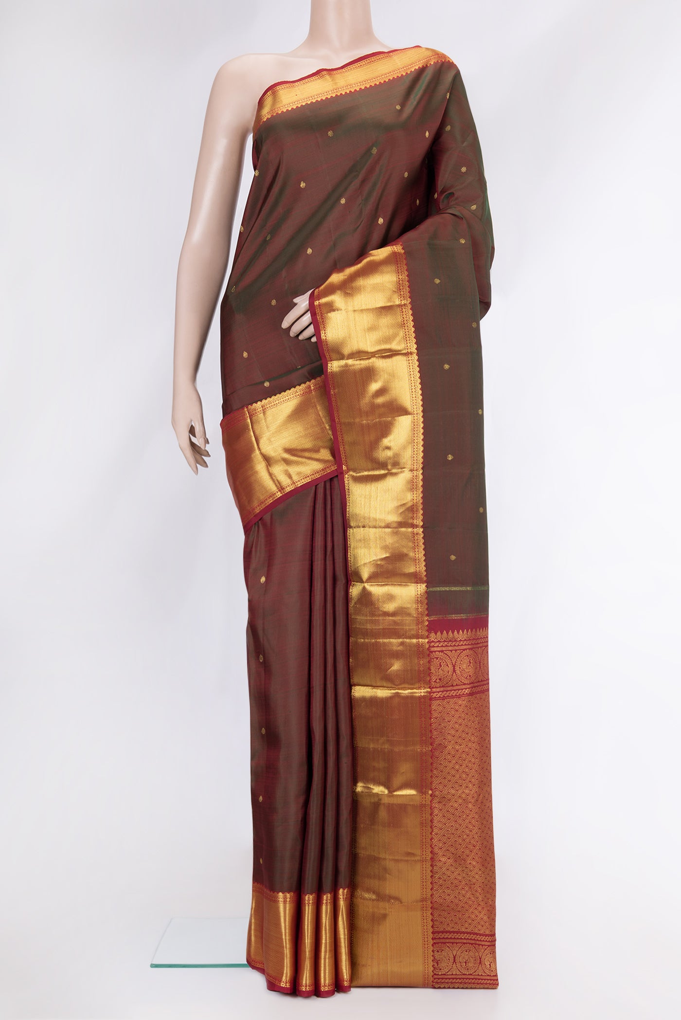 Mehandi Green Dual Tone Kanjivaram Silk Saree with Zari Butta on the body and Zari Border.  displayed on a mannequin