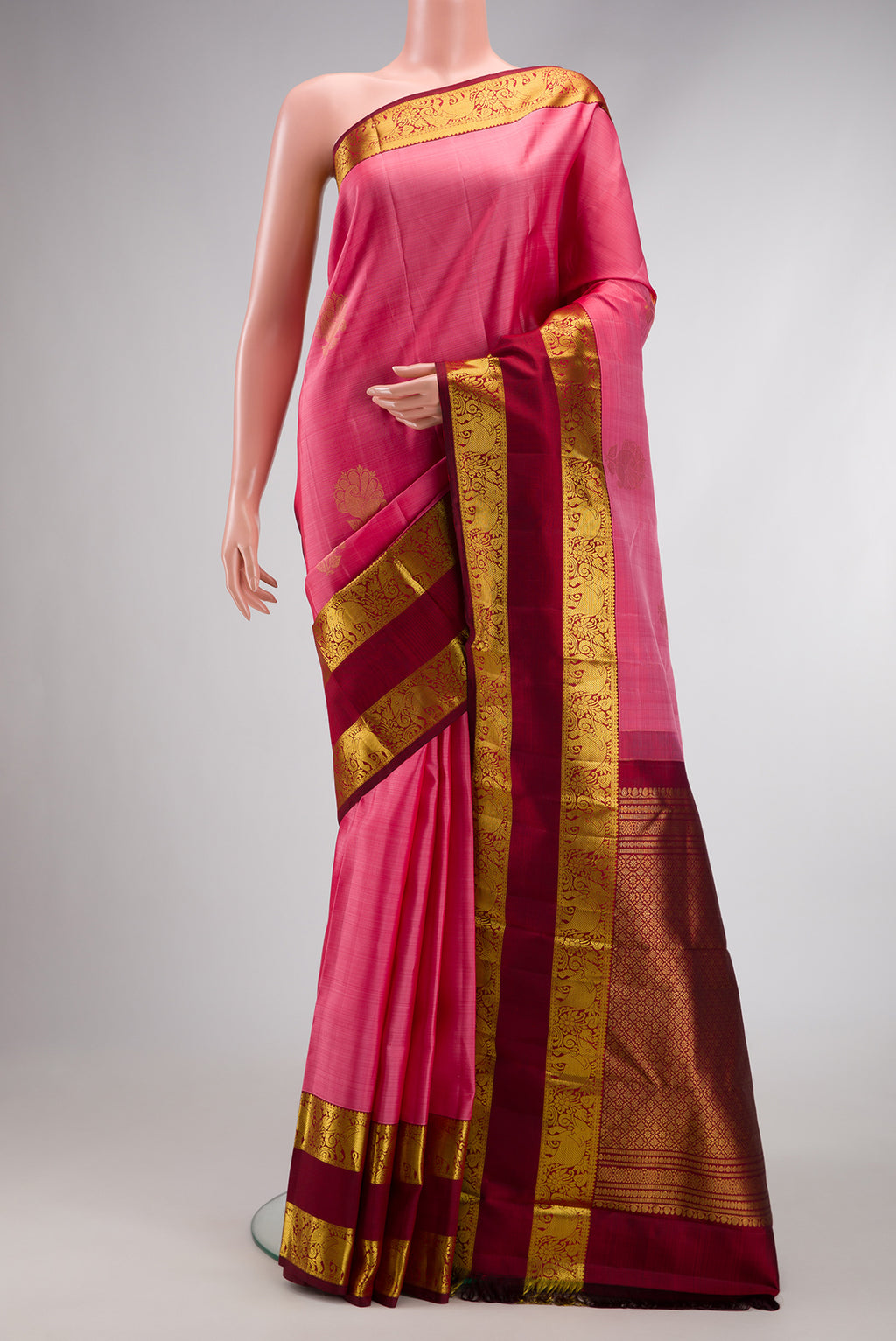 Pink Dual Tone Kanchipuram Silk Saree with Zari Butta on the body and Zari Border.  displayed on a mannequin