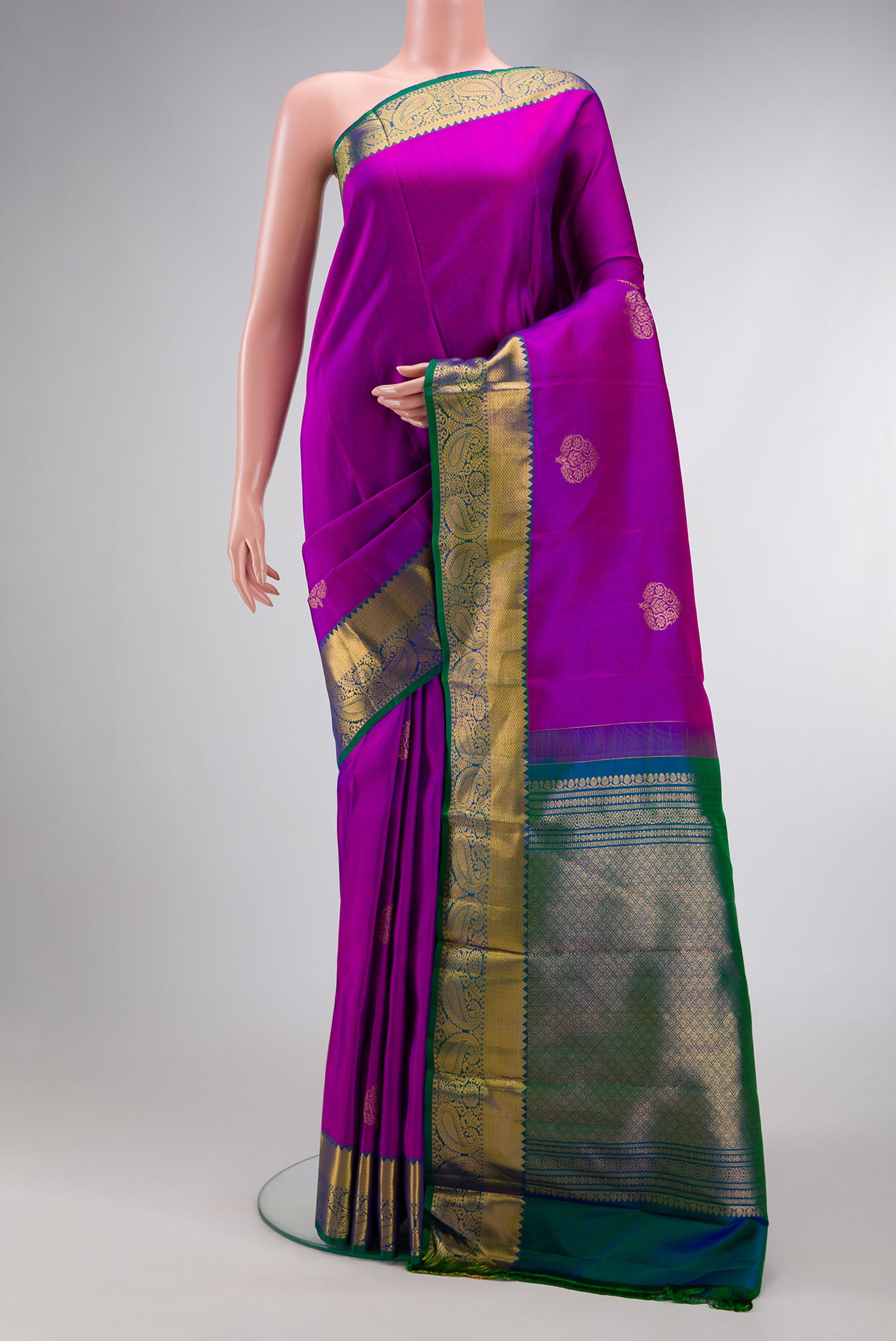 Purple Dual Tone Kanjivaram Silk Saree with Zari Butta on the body and Zari Border.  displayed on a mannequin