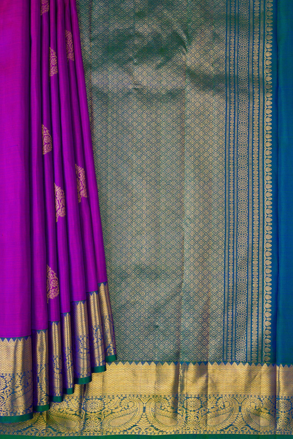 Pleats and pallu of Purple Dual Tone Kanjivaram Silk Saree with Zari Butta on the body and Zari Border. 