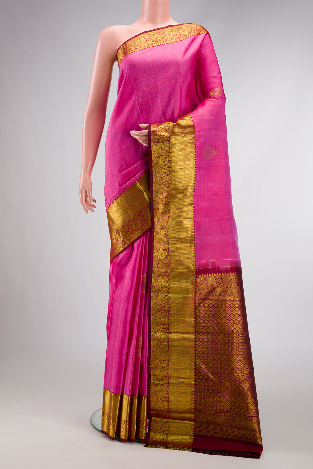 Pink Dual Tone Kanjivaram Silk Saree with Zari Butta on the body and Zari Border.  displayed on a mannequin