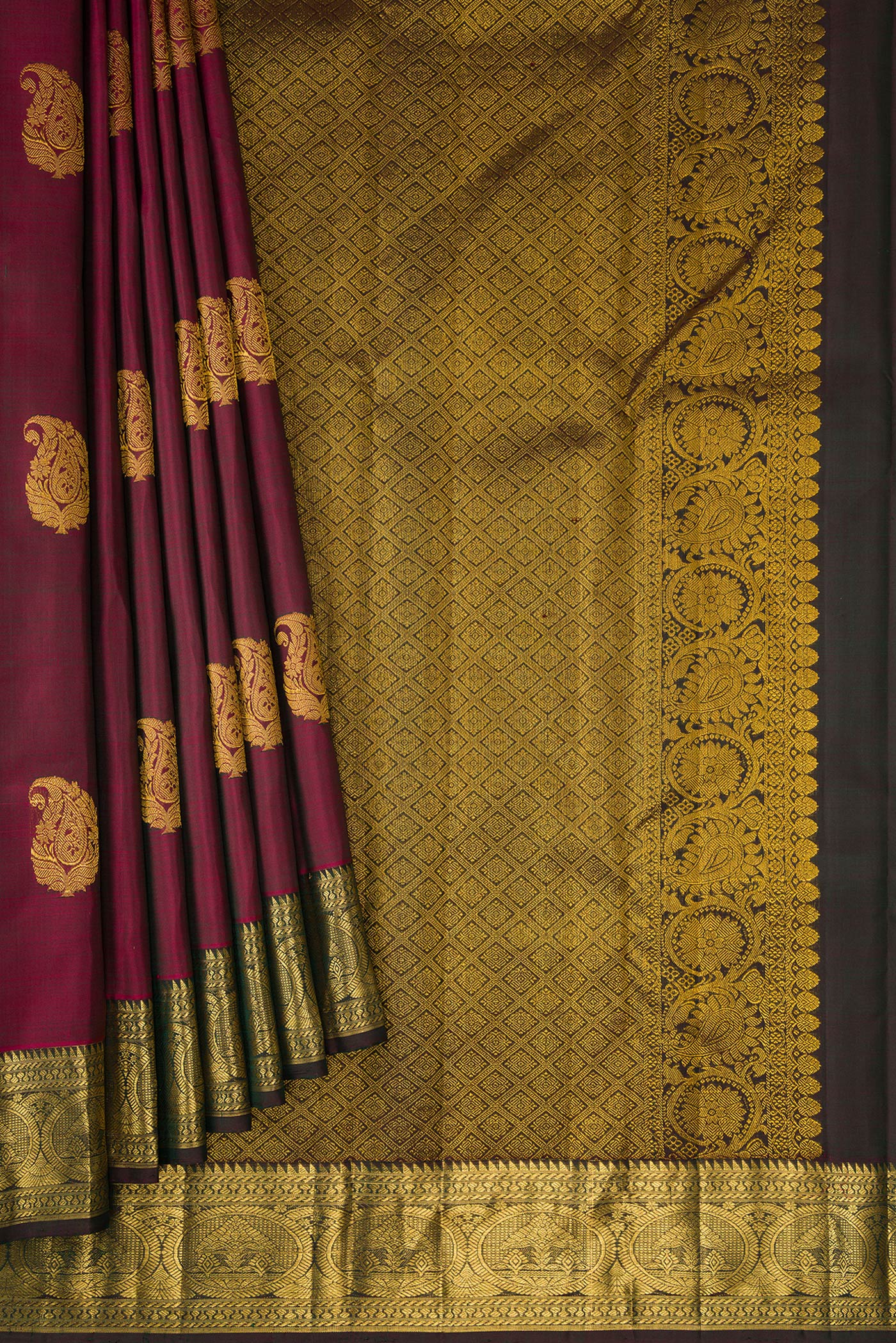 Pleats and pallu of Burgundy Dual Tone Kanjivaram Silk Saree with Zari Butta on the body and Zari Border. 