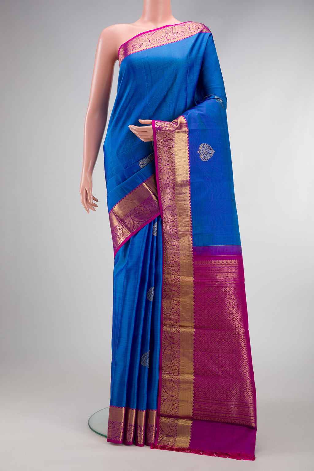 Royal Blue Dual Tone Kanjivaram Silk Saree with Zari Butta on the body and Zari Border.  displayed on a mannequin