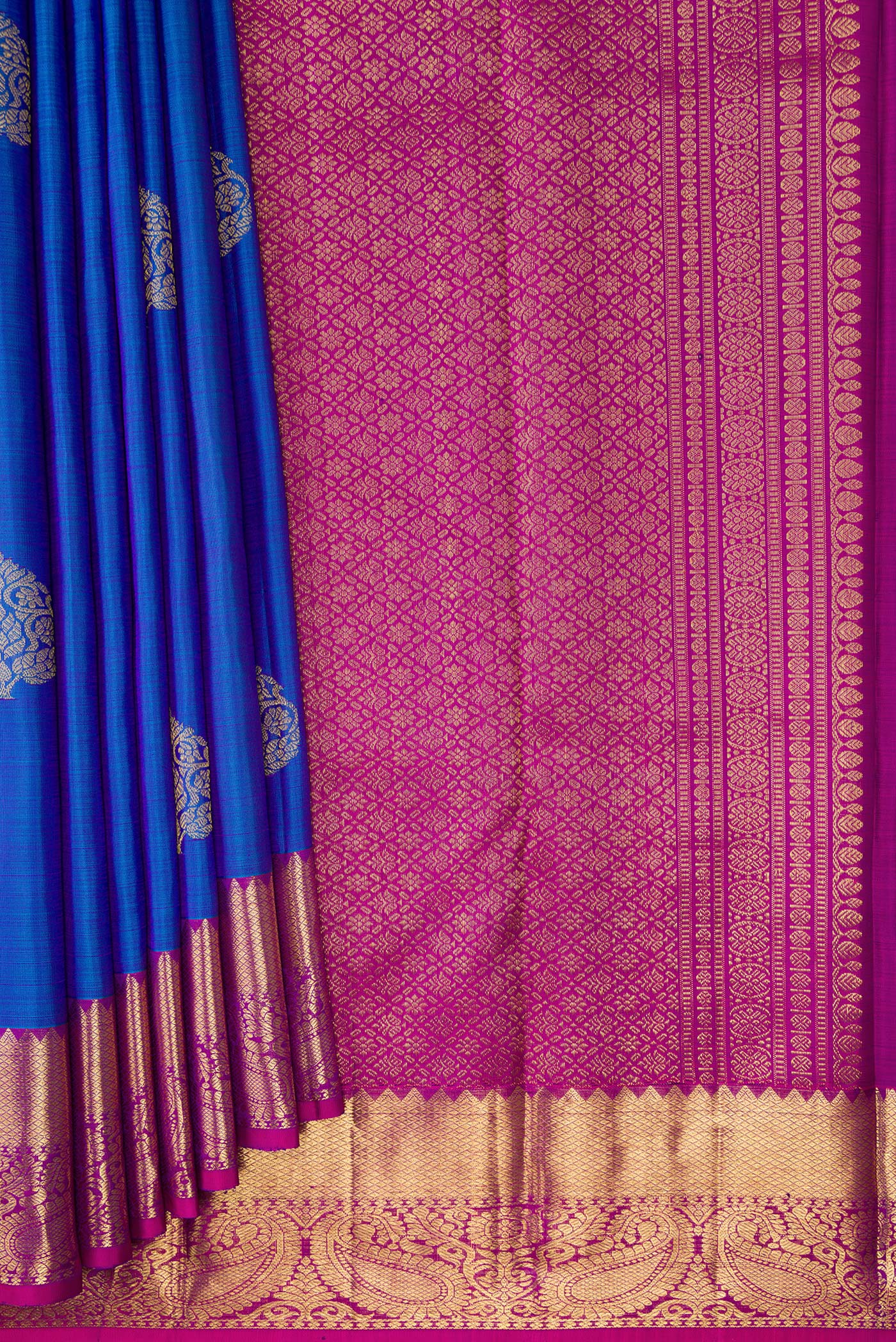 Pleats and pallu of Royal Blue Dual Tone Kanjivaram Silk Saree with Zari Butta on the body and Zari Border. 