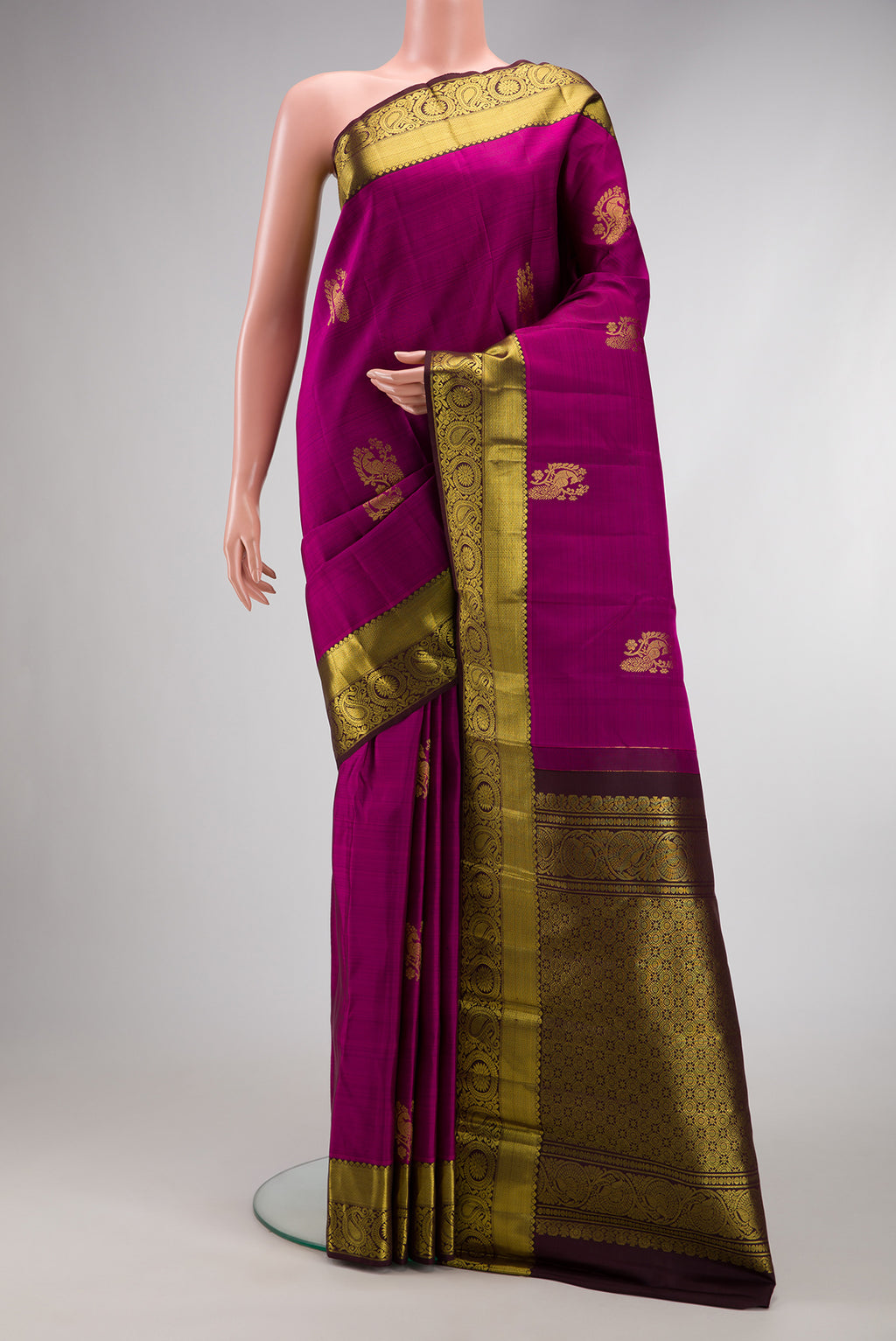 Purple Dual Tone Kanjivaram Silk Saree with Zari Butta on the body and Zari Border.  displayed on a mannequin
