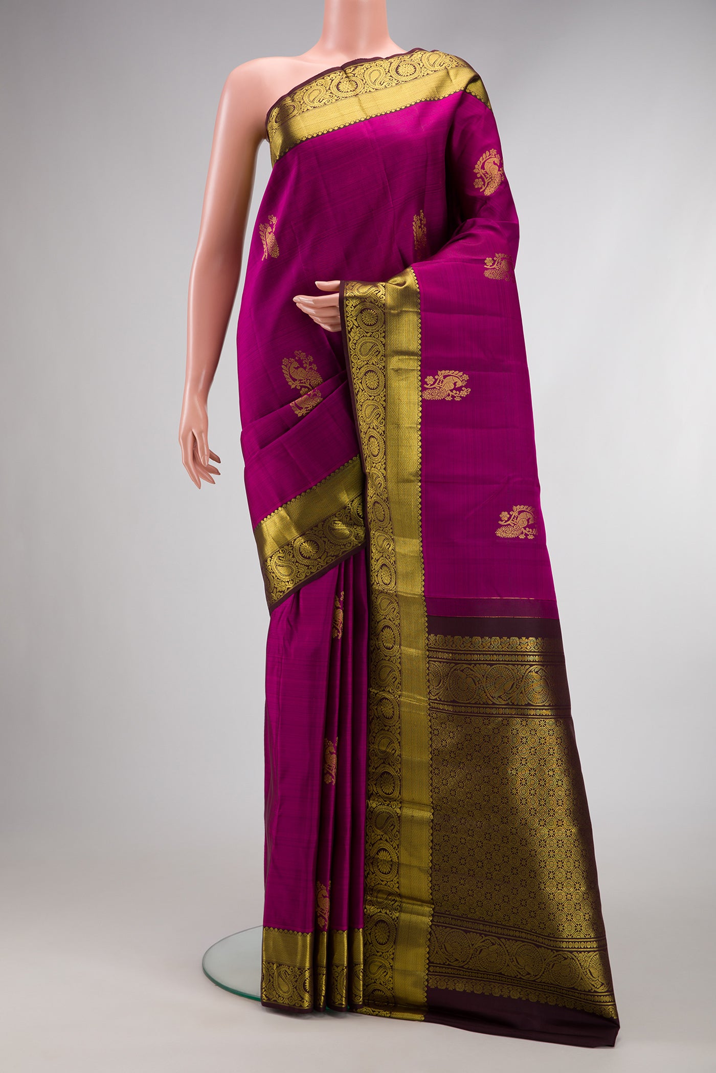 Purple Dual Tone Kanjivaram Silk Saree with Zari Butta on the body and Zari Border.  displayed on a mannequin
