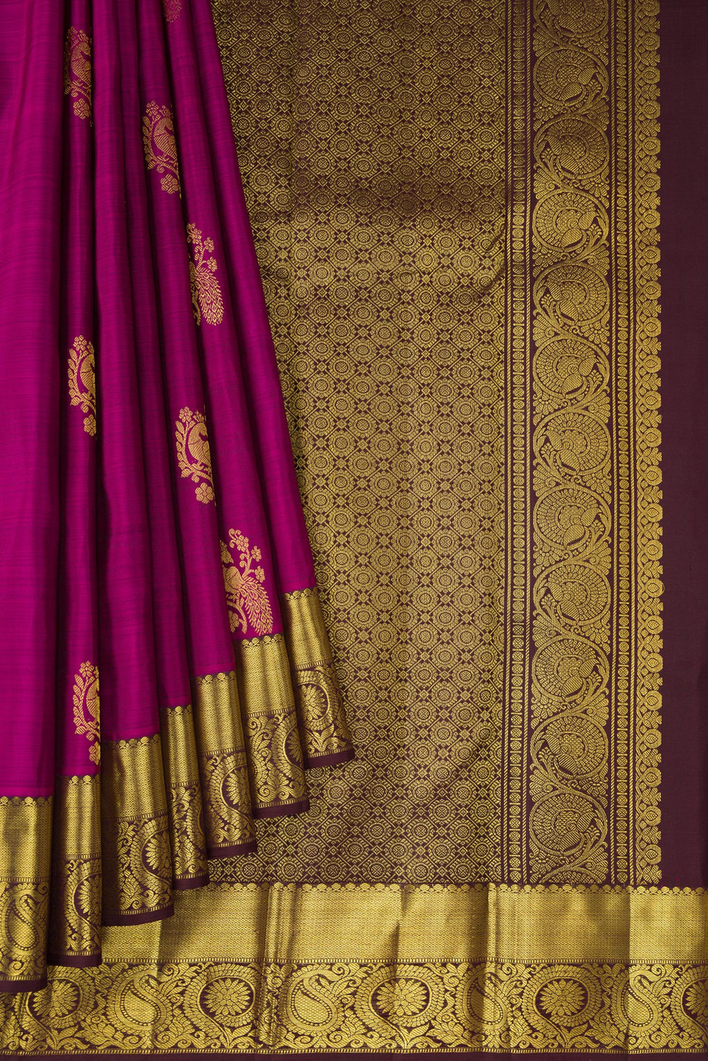 Pleats and pallu of Purple Dual Tone Kanjivaram Silk Saree with Zari Butta on the body and Zari Border. 