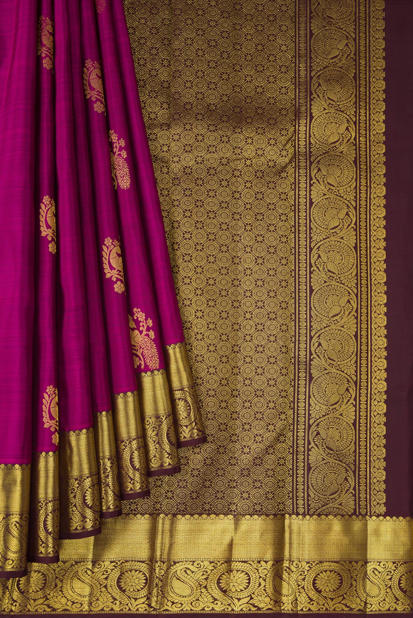 Pleats and pallu of Purple Dual Tone Kanjivaram Silk Saree with Zari Butta on the body and Zari Border. 