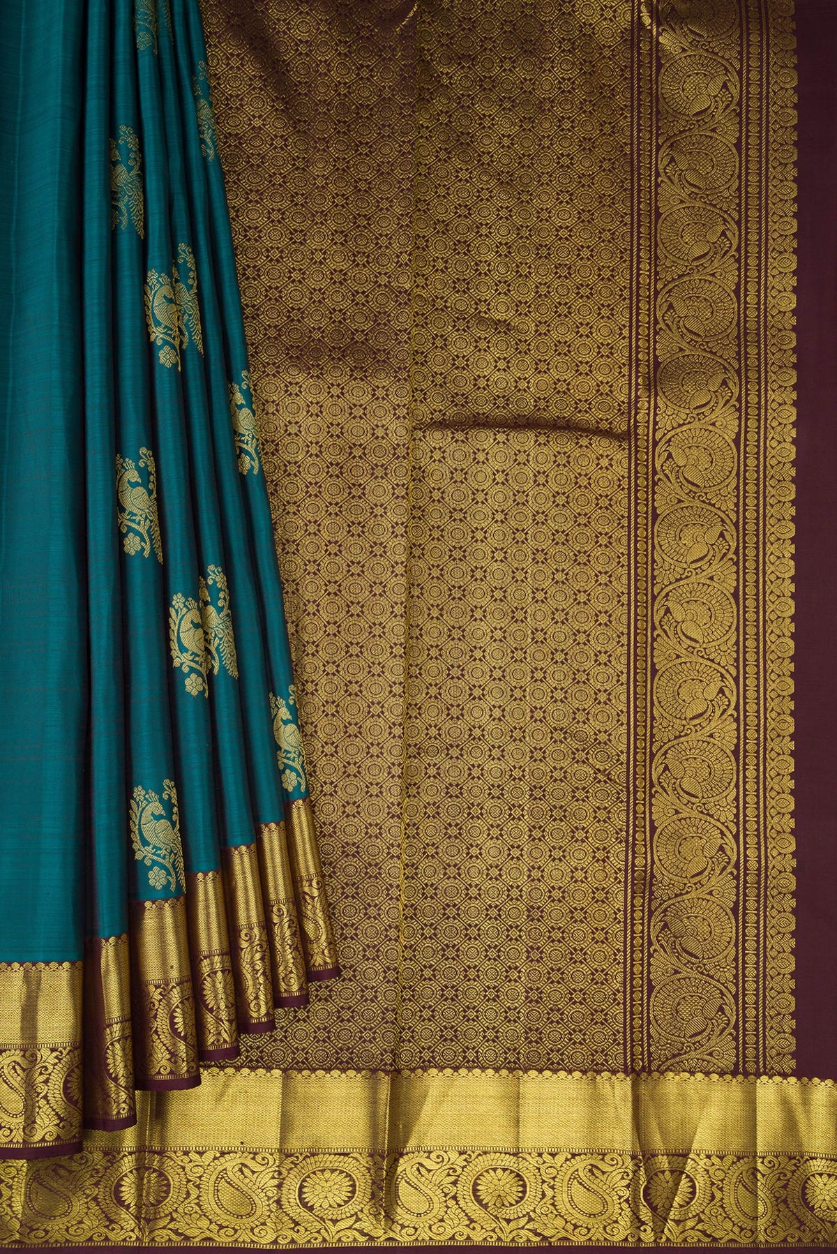 Pleats and pallu of Teal Dual Tone Kanjivaram Silk Saree with Zari Butta on the body and Zari Border. 