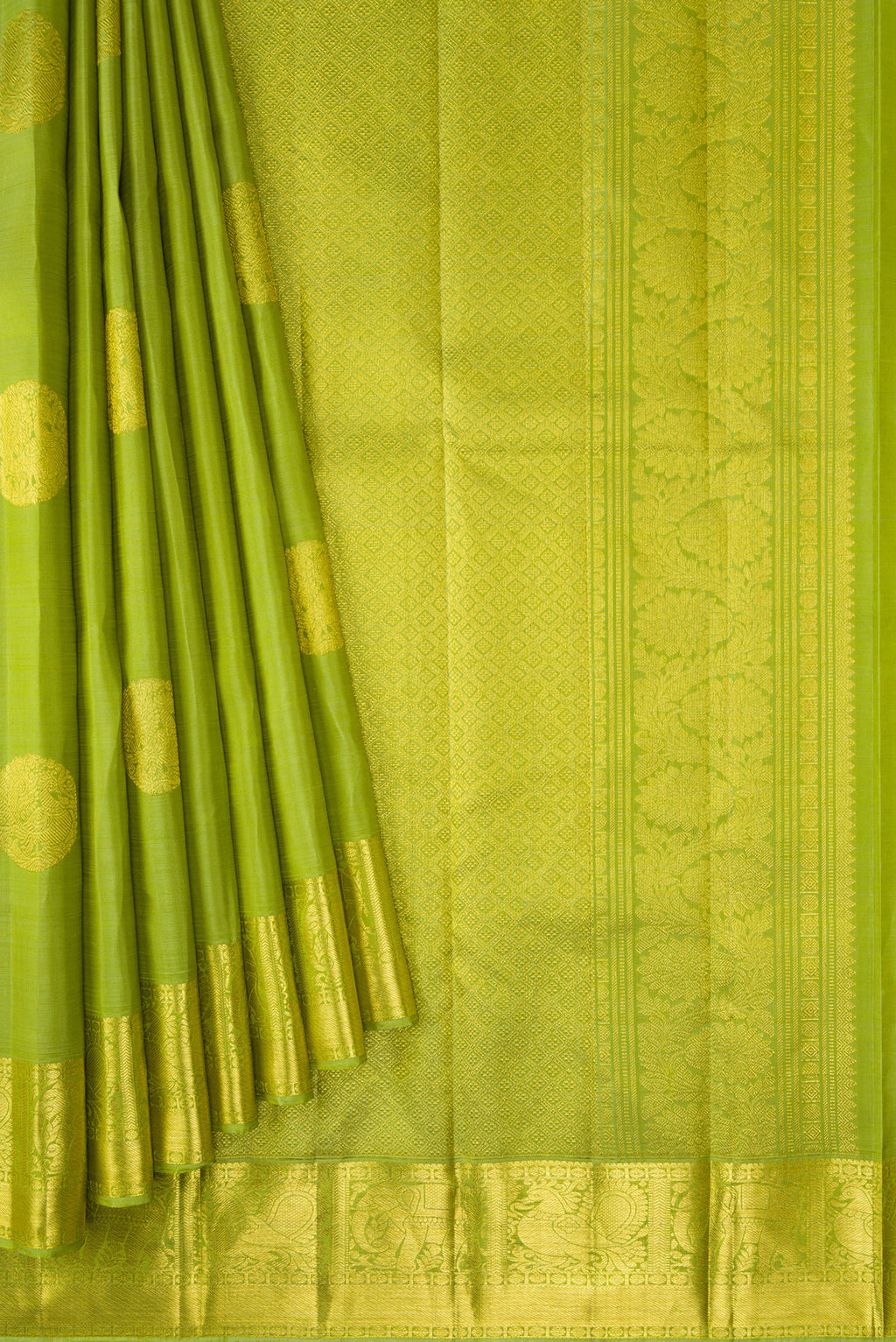 Pleats and pallu of Green Dual Tone Kanjivaram Silk Saree with Zari Butta on the body and Zari Border. 