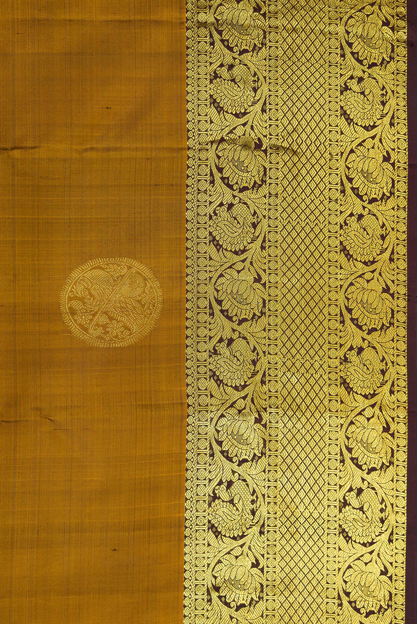 Border image of Gold Dual Tone Kanjivaram Silk Saree with Zari Butta on the body and Zari Border. 