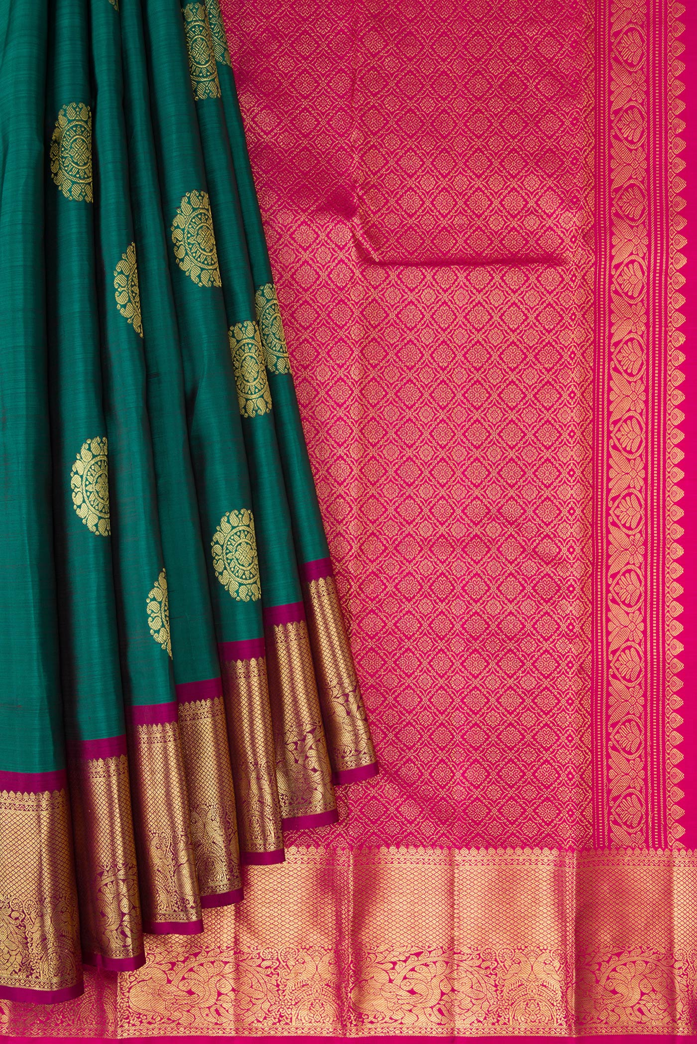 Pleats and pallu of Bottle Green Dual Tone Kanjivaram Silk Saree with Zari Butta on the body and Zari Border. 