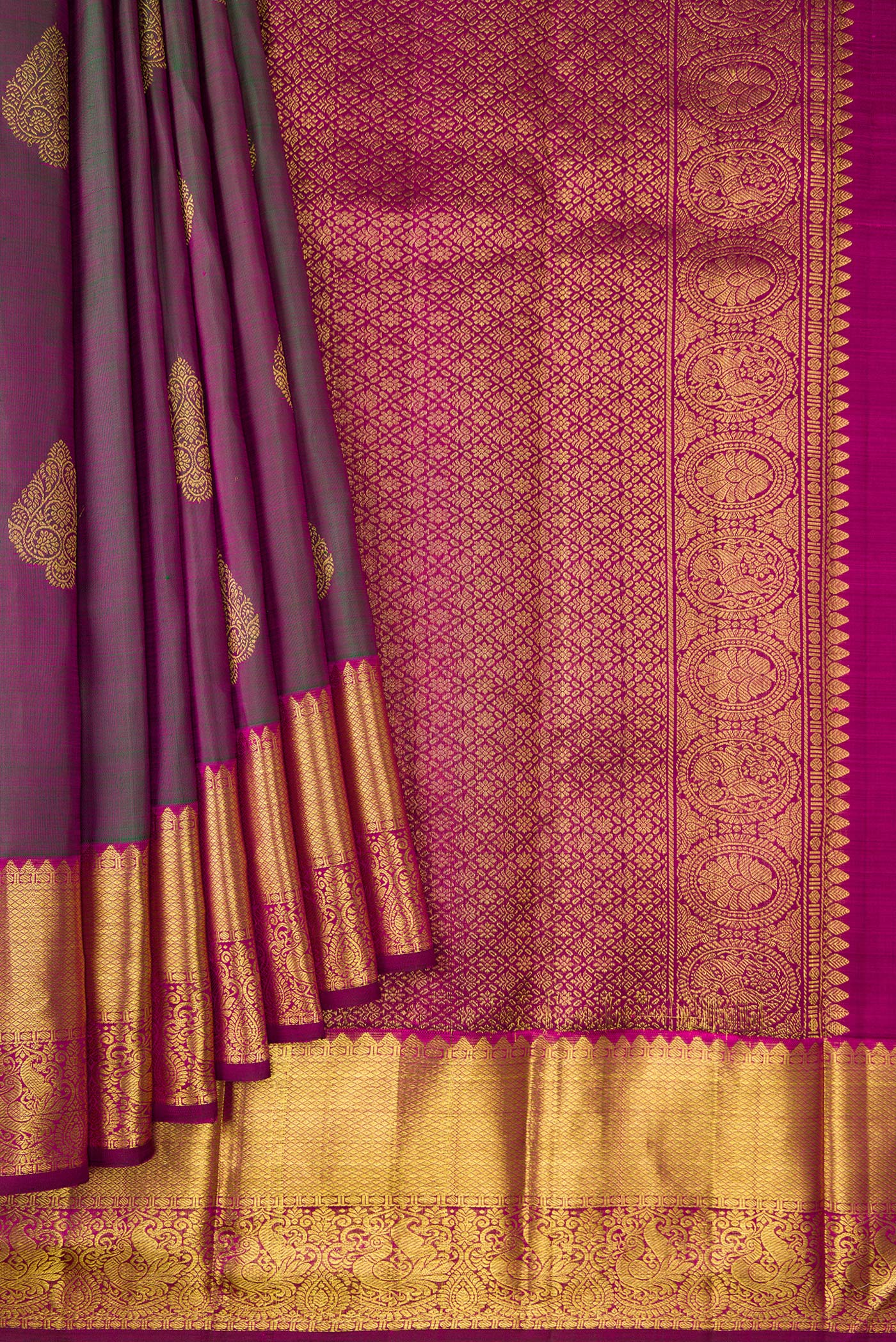 Pleats and pallu of Bottle Green Dual Tone Kanjivaram Silk Saree with Zari Butta on the body and Zari Border. 