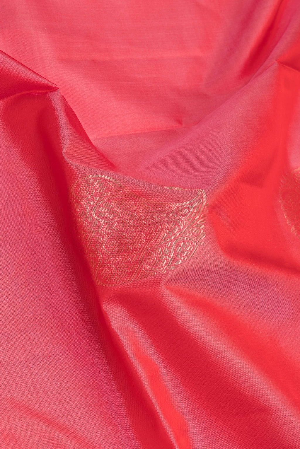 Close up of Pink Soft Silk Saree with Zari Butta on the body and Zari Border.  displaying folds