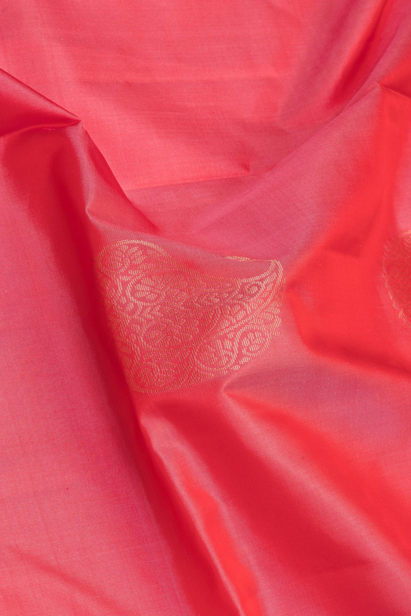 Close up of Pink Soft Silk Saree with Zari Butta on the body and Zari Border.  displaying folds