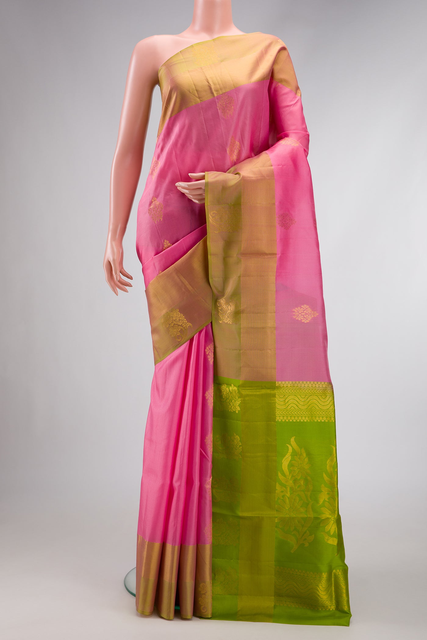 Pink Dual Tone Soft Silk Saree with Zari Butta on the body and Fancy Border.  displayed on a mannequin
