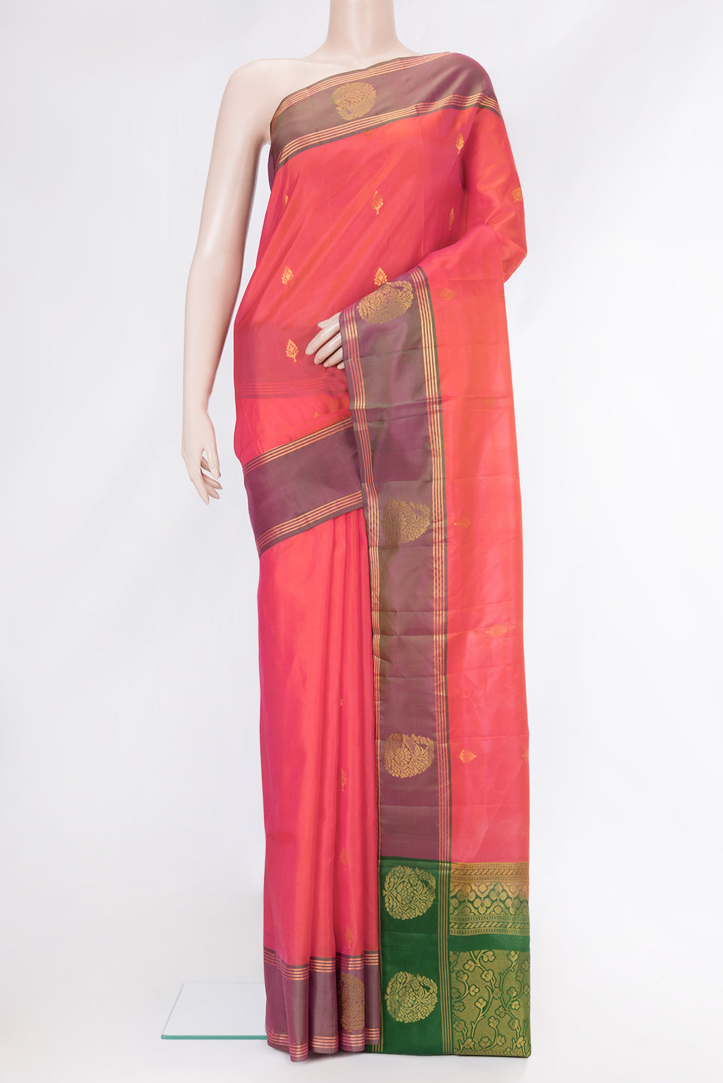 Coral Dual Tone Soft Silk Saree with Zari Butta on the body and Fancy Border.  displayed on a mannequin