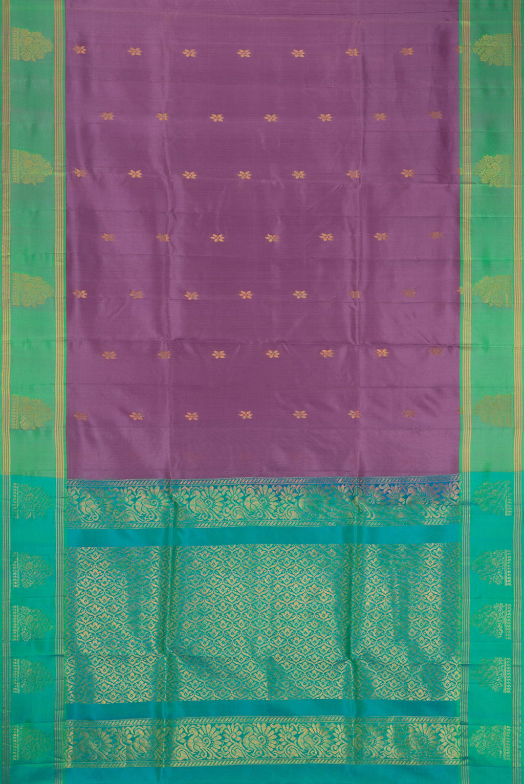 Lilac Soft Silk Saree with Zari Butta on the body and Zari Border.  displayed on a mannequin