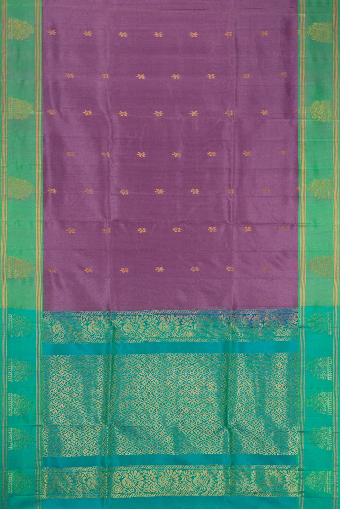Flat view of Lilac Soft Silk Saree with Zari Butta on the body and Zari Border. 