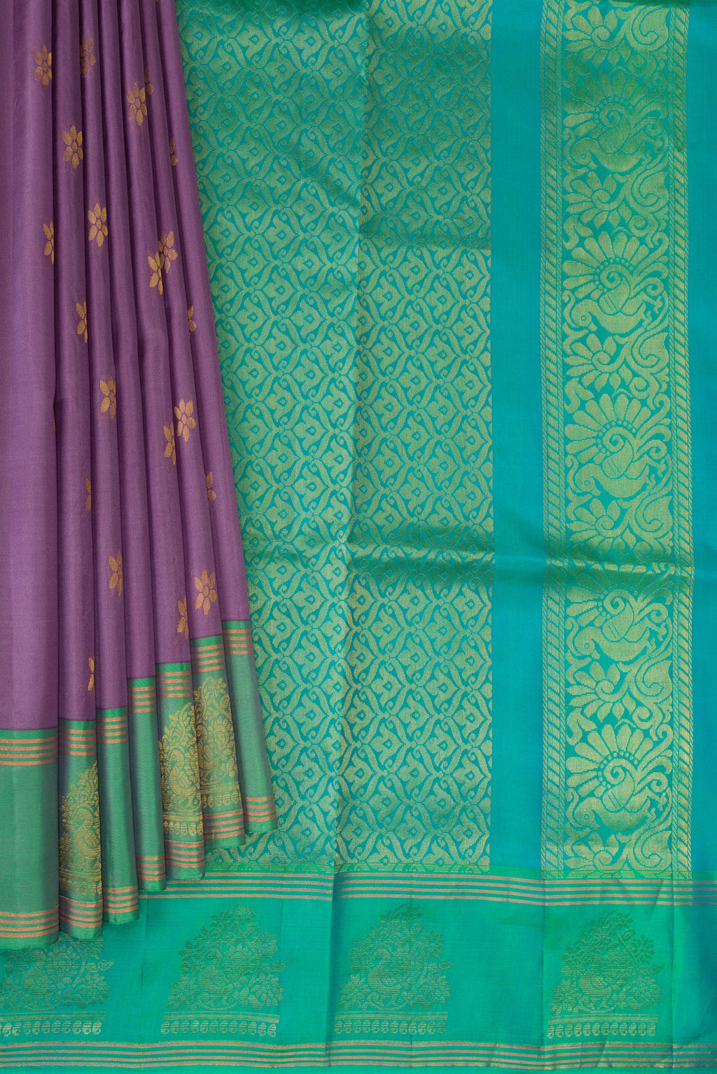 Pleats and pallu of Lilac Soft Silk Saree with Zari Butta on the body and Zari Border. 