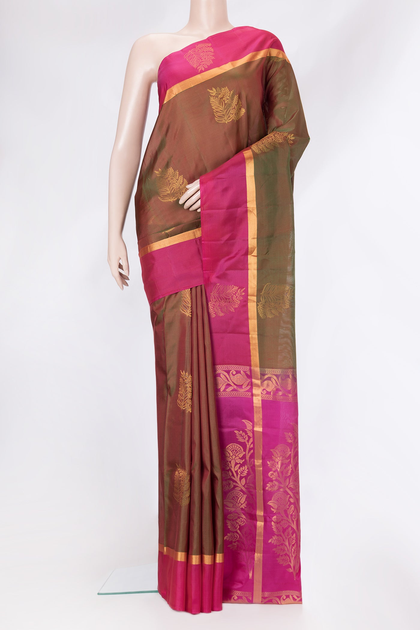 Mehandi Green Dual Tone Soft Silk Saree with Zari Butta on the body and Zari Border.  displayed on a mannequin