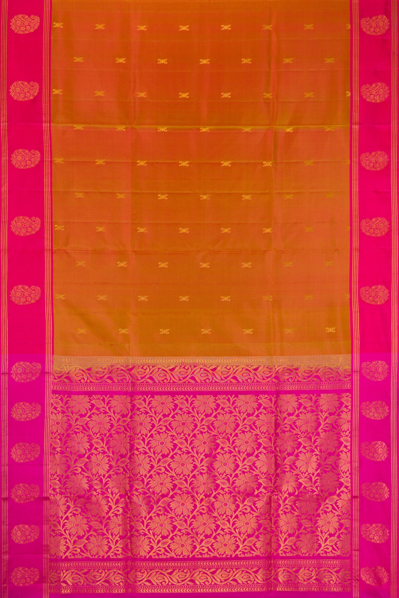 Brick Orange Dual Tone Soft Silk Saree with Zari Butta on the body and Fancy Border.  displayed on a mannequin