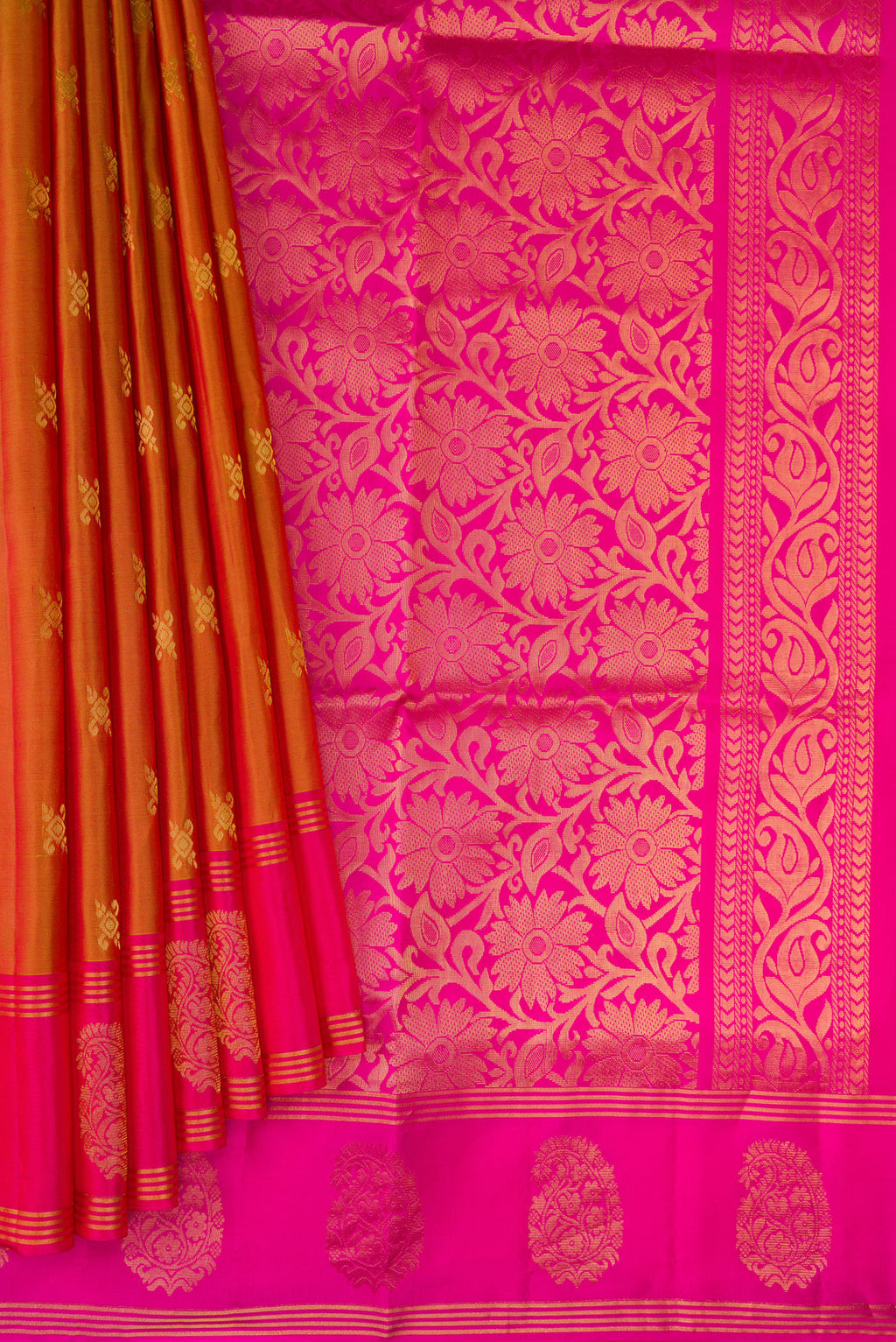 Pleats and pallu of Brick Orange Dual Tone Soft Silk Saree with Zari Butta on the body and Fancy Border. 