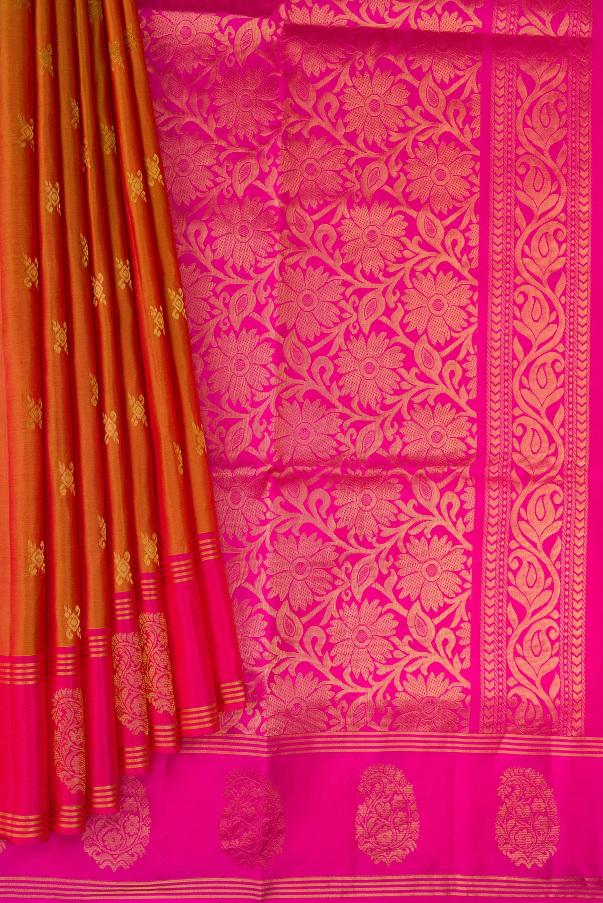Pleats and pallu of Brick Orange Dual Tone Soft Silk Saree with Zari Butta on the body and Fancy Border. 