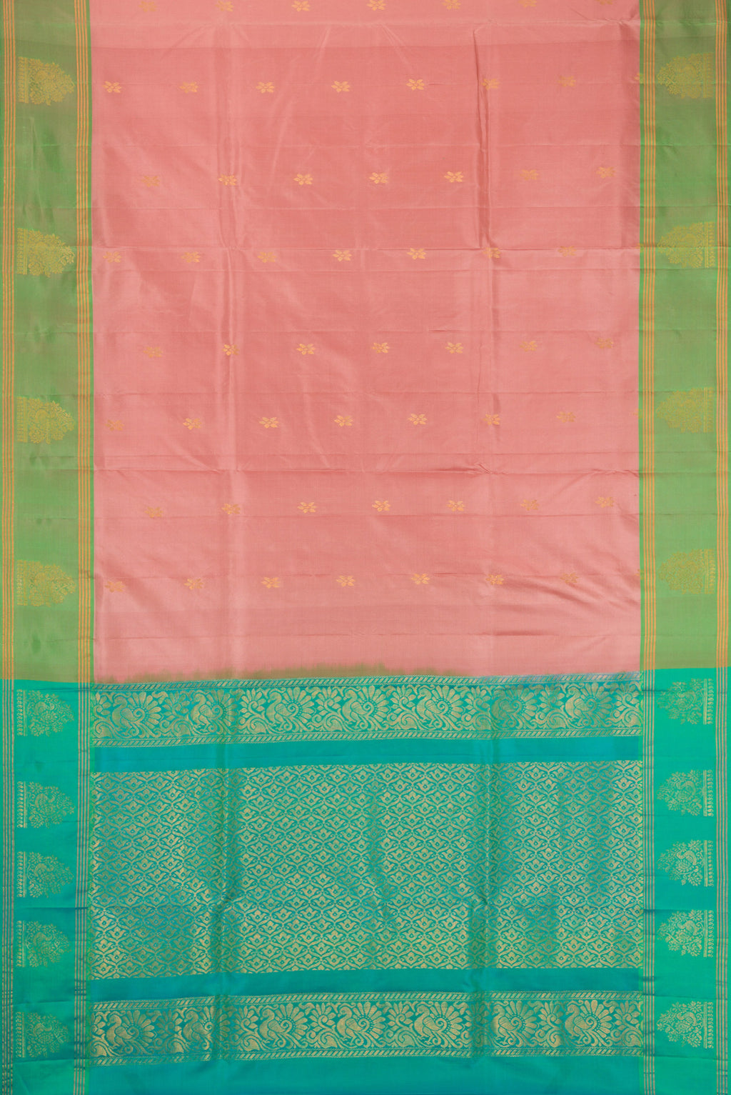 Rose Gold Soft Silk Saree with Zari Butta on the body and Fancy Border.  displayed on a mannequin