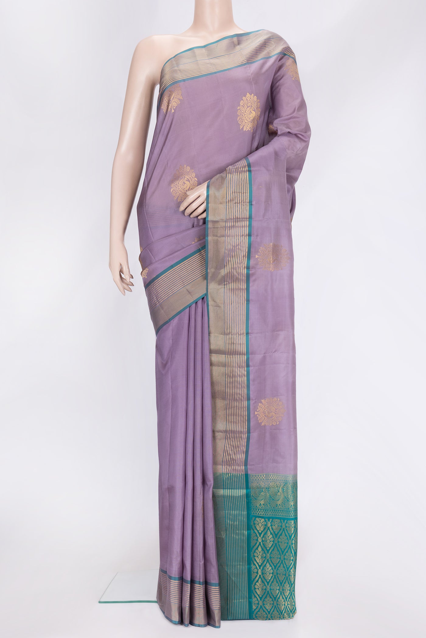 Lavender Dual Tone Soft Silk Saree with Zari Butta on the body and Zari Border.  displayed on a mannequin
