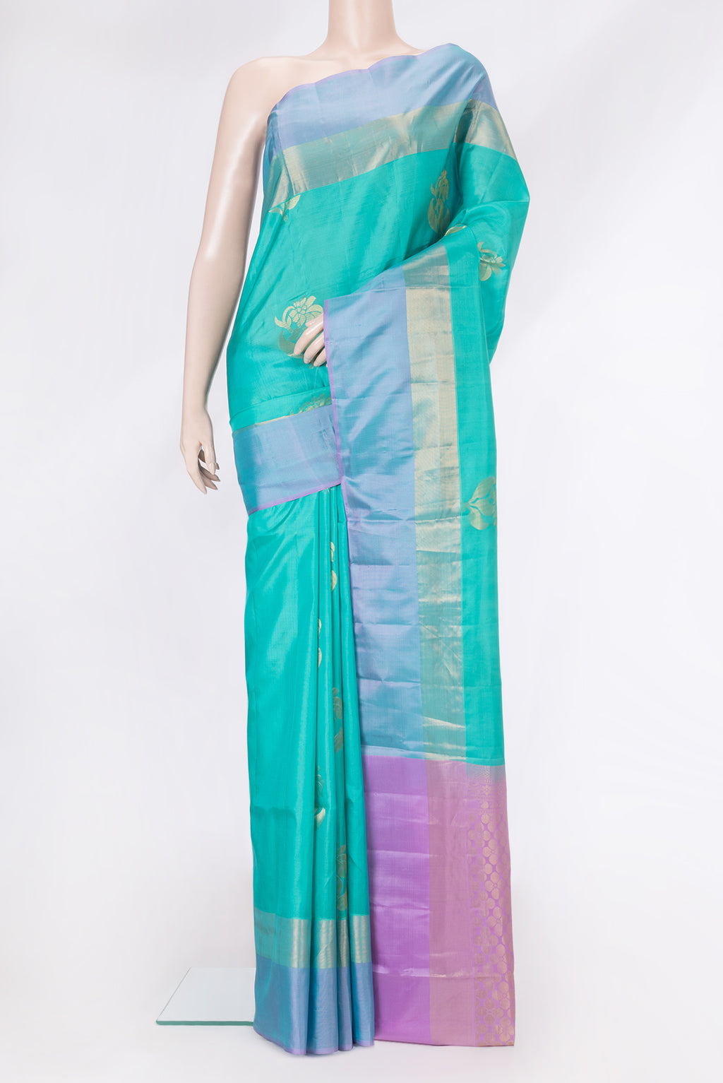 Sea Green Dual Tone Soft Silk Saree with Zari Butta on the body and Zari Border.  displayed on a mannequin