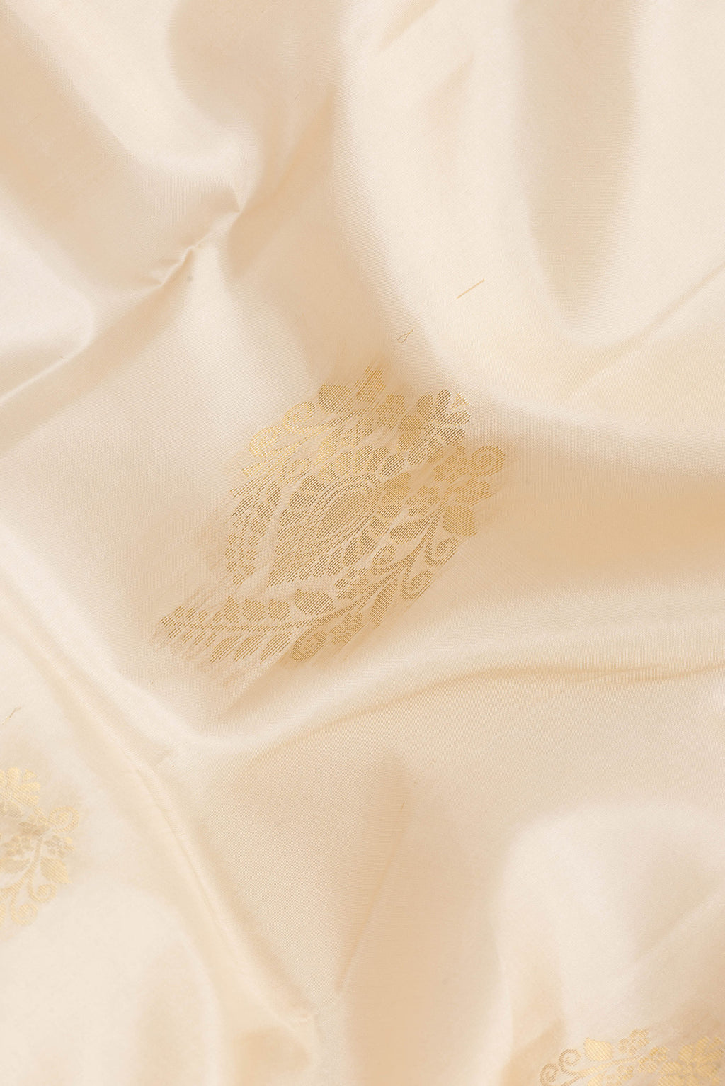Close up of Sandal Dual Tone Soft Silk Saree with Zari Butta on the body and Zari Border.  displaying folds