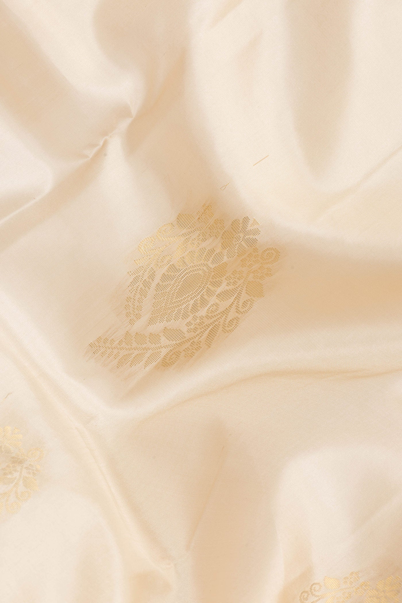 Close up of Sandal Dual Tone Soft Silk Saree with Zari Butta on the body and Zari Border.  displaying folds