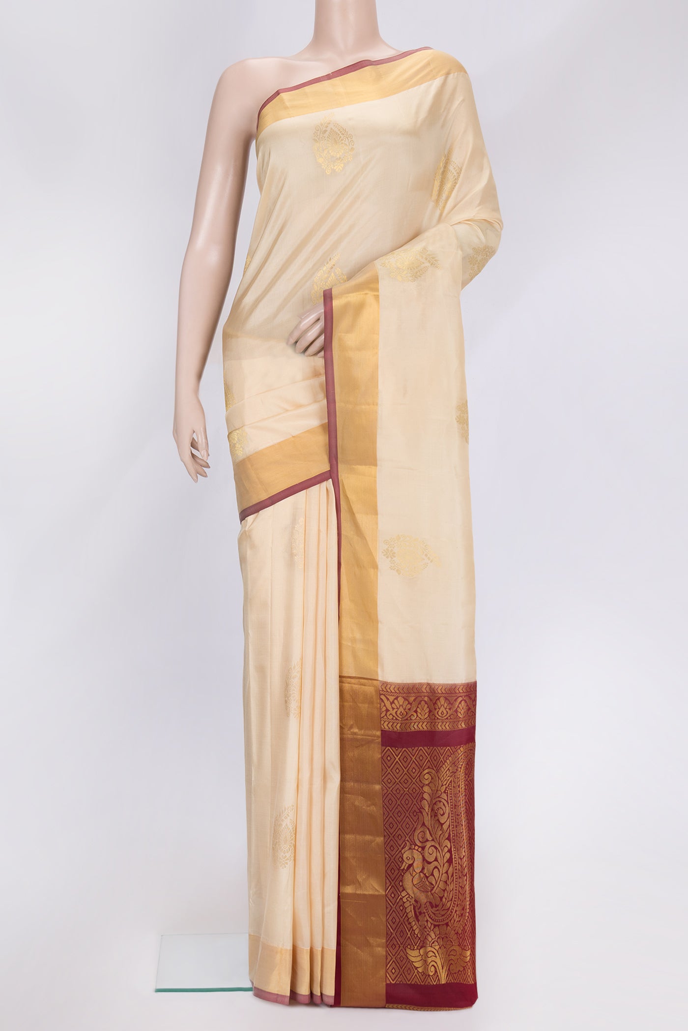 Sandal Dual Tone Soft Silk Saree with Zari Butta on the body and Zari Border.  displayed on a mannequin