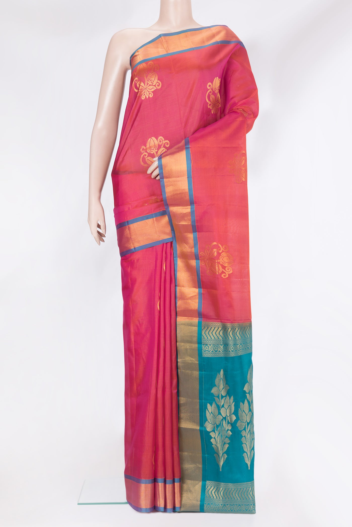 Dark Pink Soft Silk Saree with Zari Butta on the body and Zari Border.  displayed on a mannequin