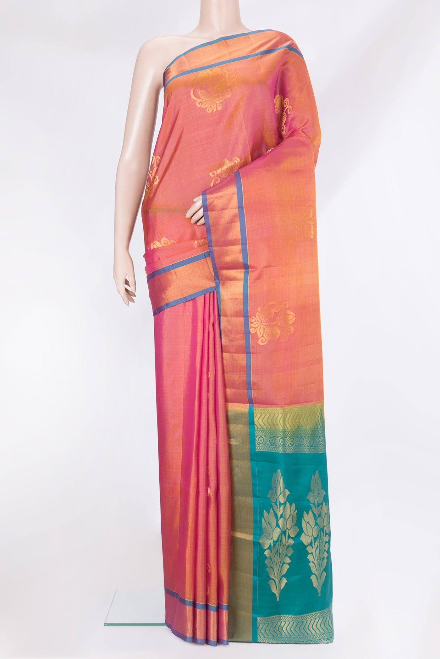 Pinkish Yellow Dual Tone Soft Silk Saree with Zari Butta on the body and Zari Border.  displayed on a mannequin