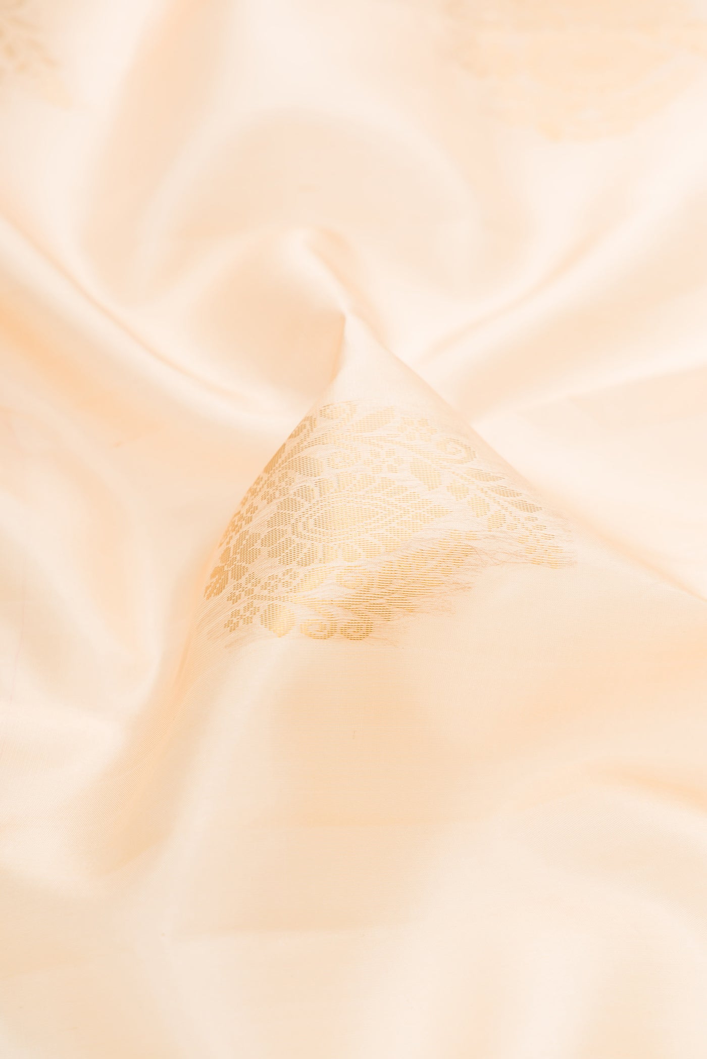 Close up of Sandal Dual Tone Soft Silk Saree with Zari Butta on the body and Zari Border.  displaying folds
