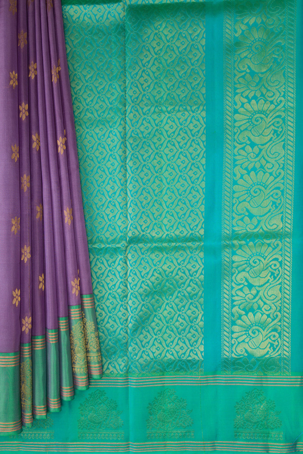 Pleats and pallu of Lavender Soft Silk Saree with Zari Butta on the body and Fancy Border. 