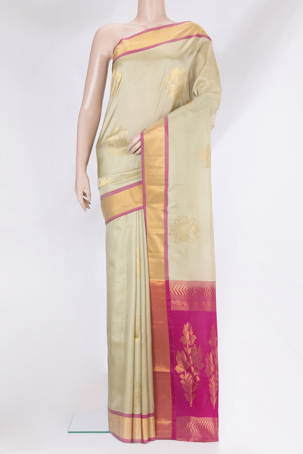 Beige Soft Silk Saree with Zari Butta on the body and Zari Border.  displayed on a mannequin