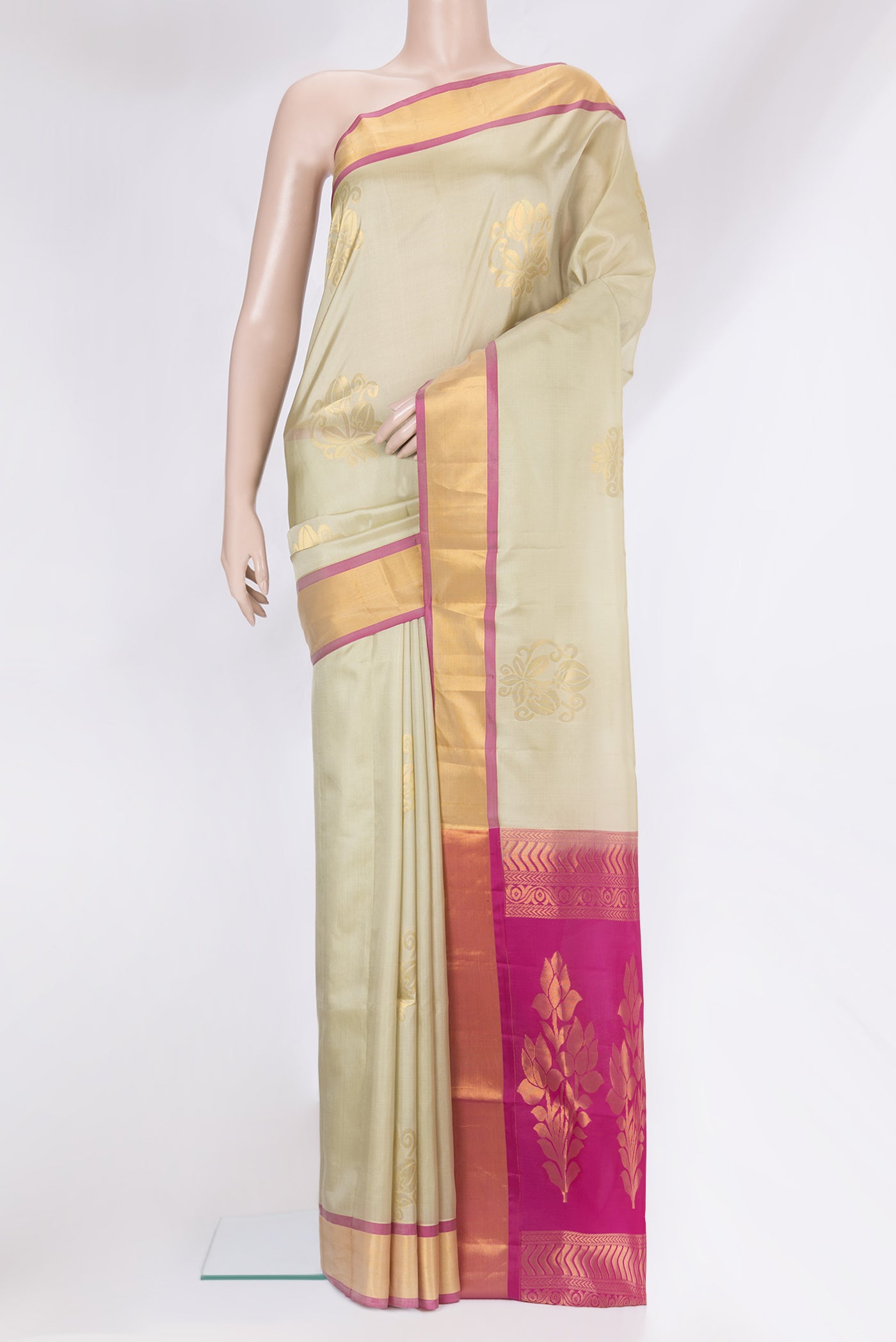 Beige Soft Silk Saree with Zari Butta on the body and Zari Border.  displayed on a mannequin