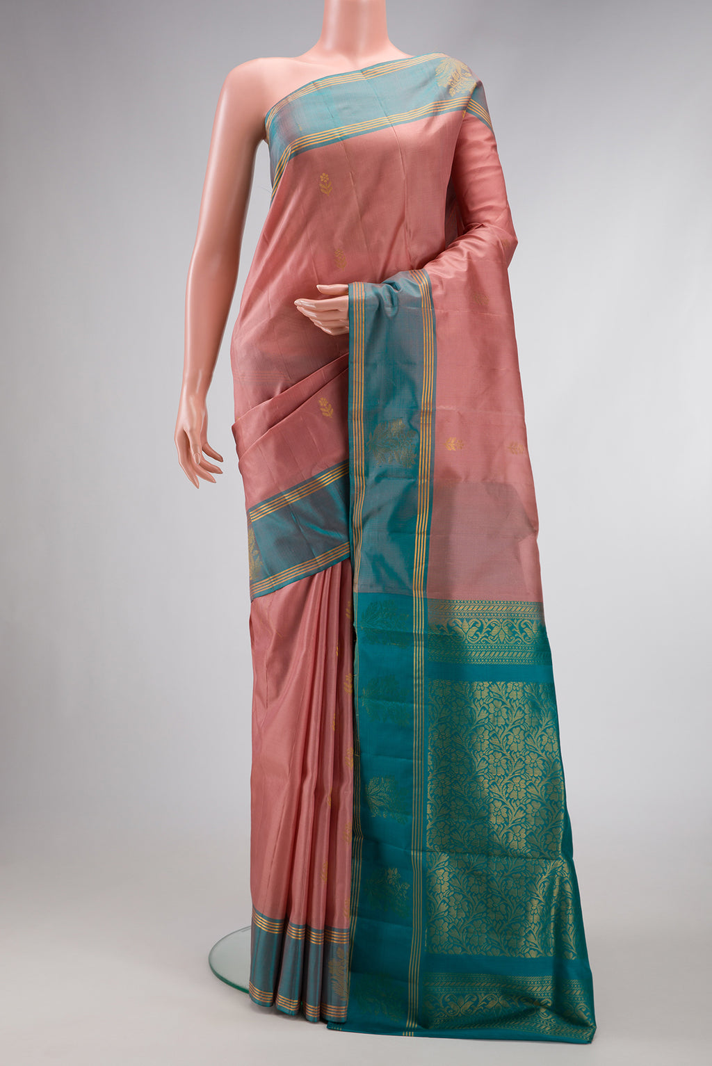 Rose Gold Dual Tone Soft Silk Saree with Zari Butta on the body and Fancy Border.  displayed on a mannequin