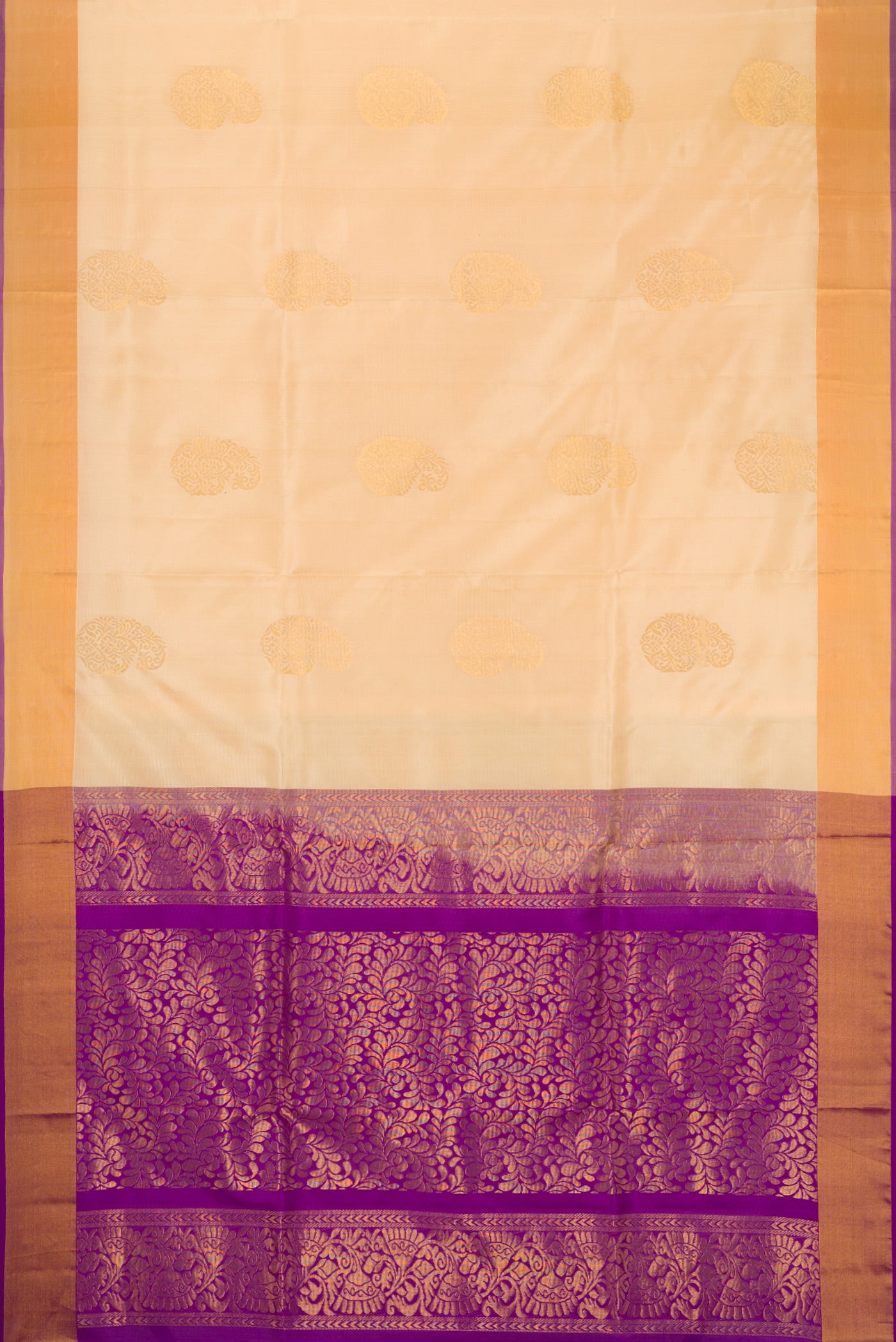 Sandal Soft Silk Saree with Zari Butta on the body and Zari Border.  displayed on a mannequin